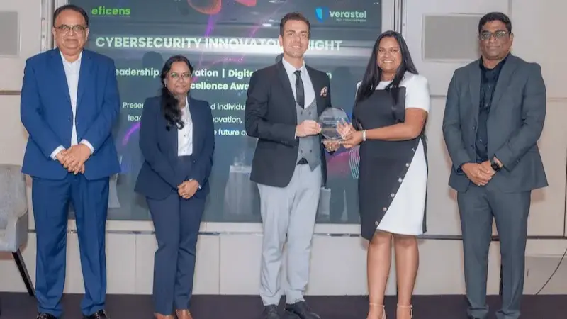 Alec Asgari receiving the Best Web Design Company 2026 award at Cybersecurity Innovators Night