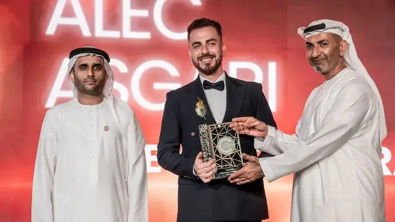 Alec Asgari with the Best IT Company 2025 award, Future Innovation Summit, Dubai